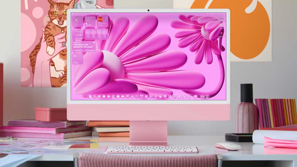 A pink iMac running macOS Tahoe